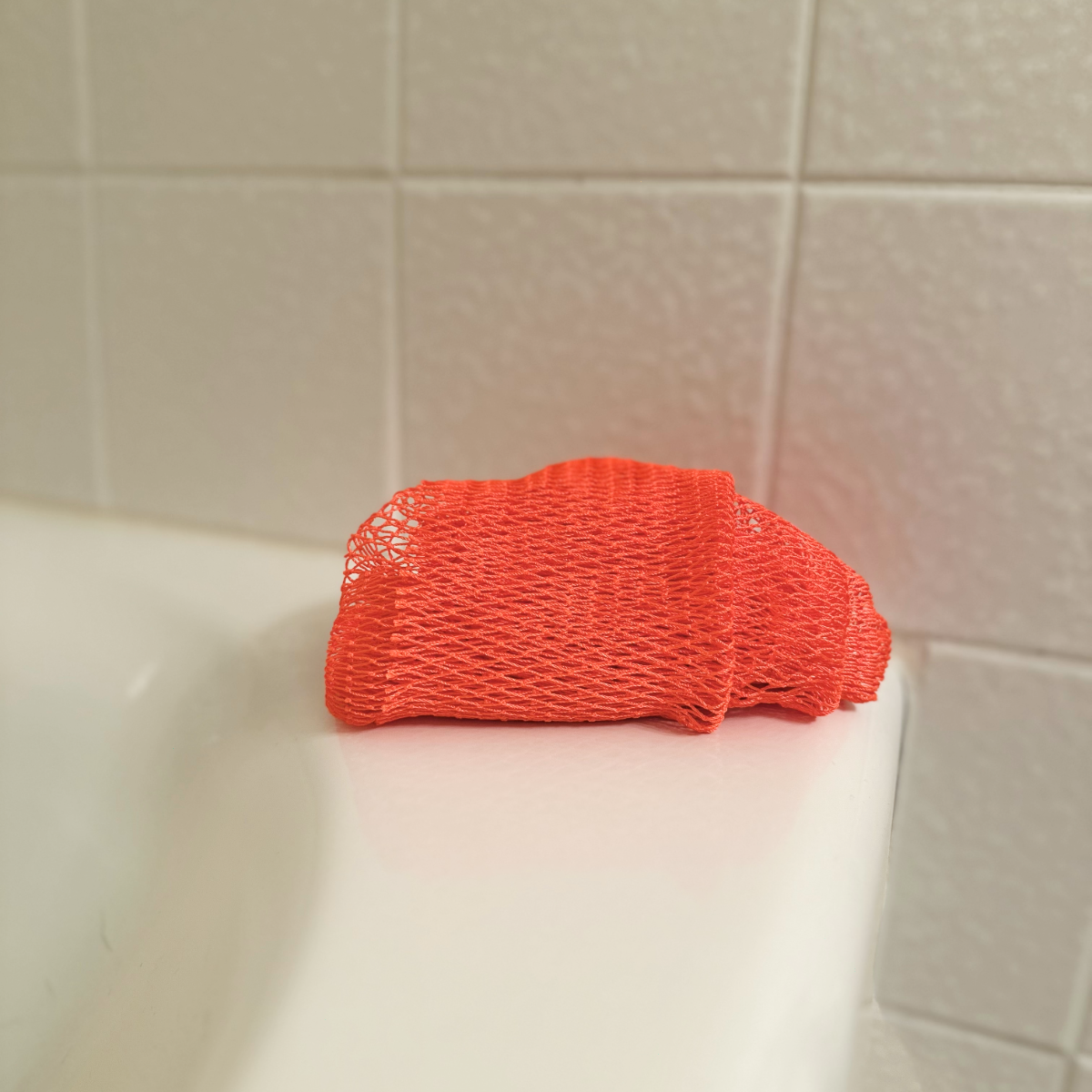 African Net Sponge - Coral, on tub