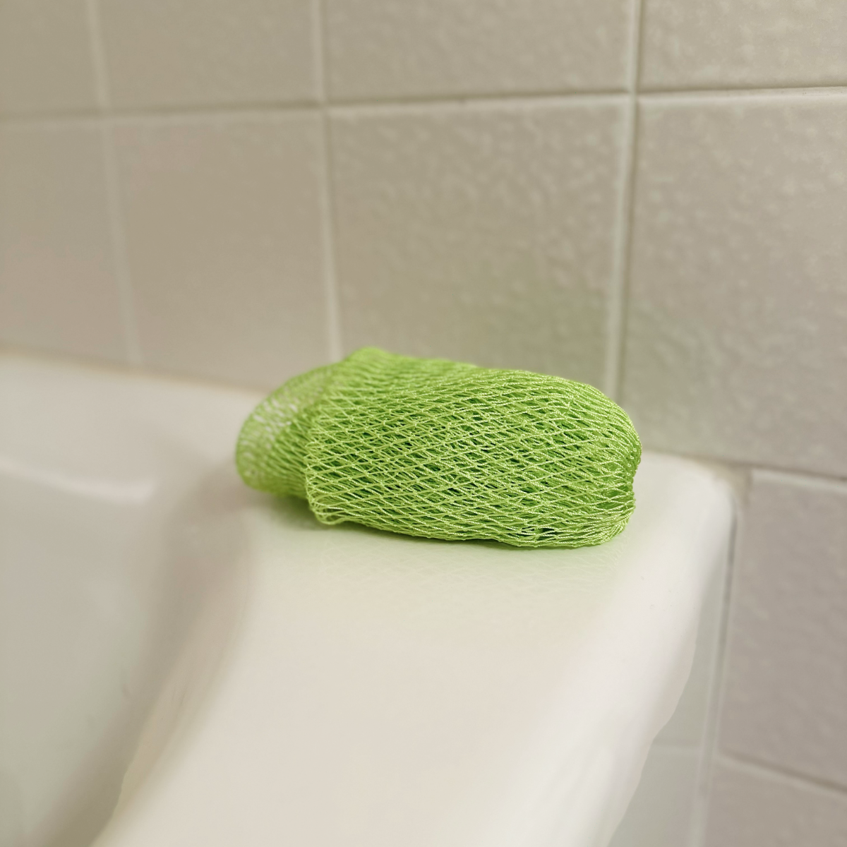 African Net Sponge - Lime, on tub