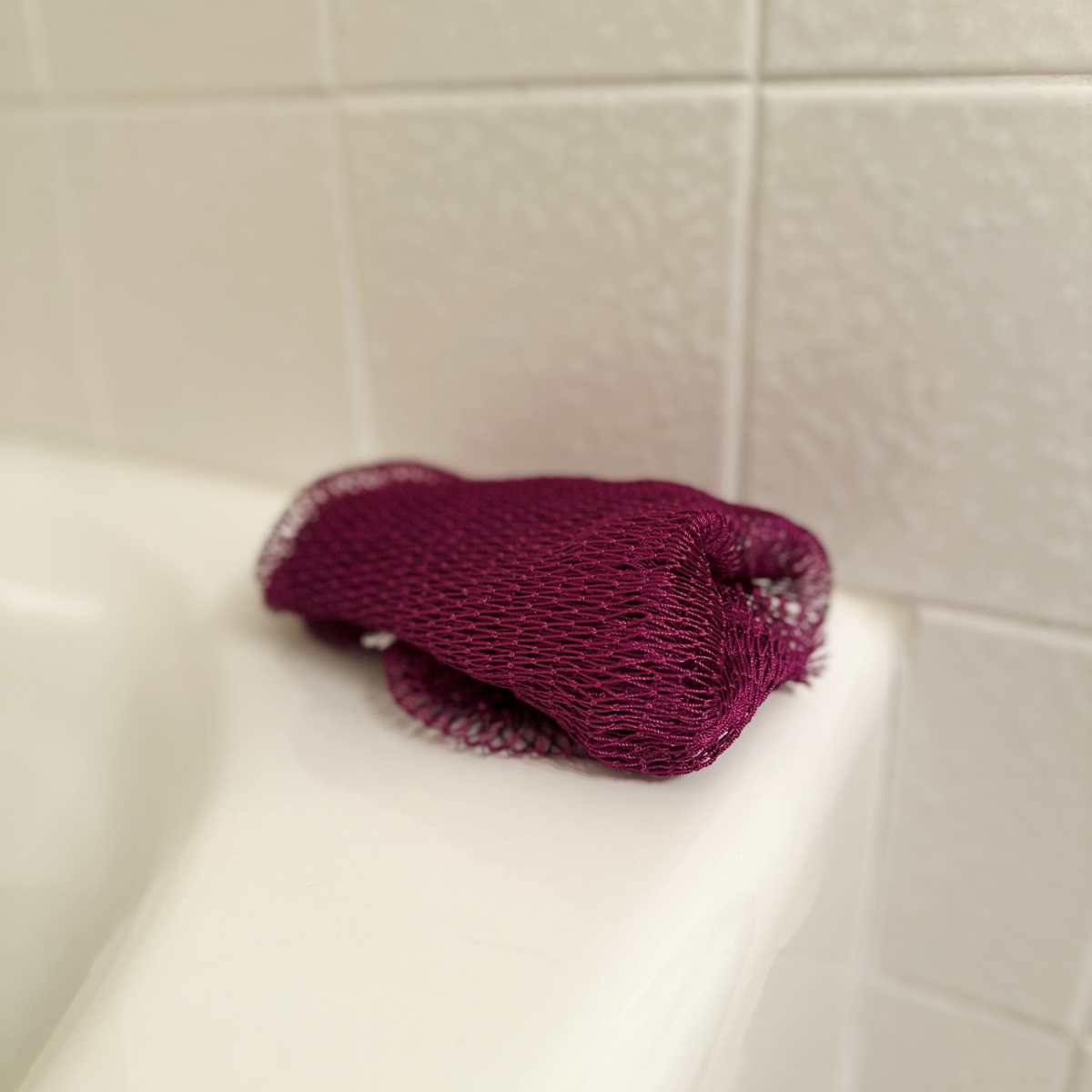 African Net Sponge - Purple, on tub