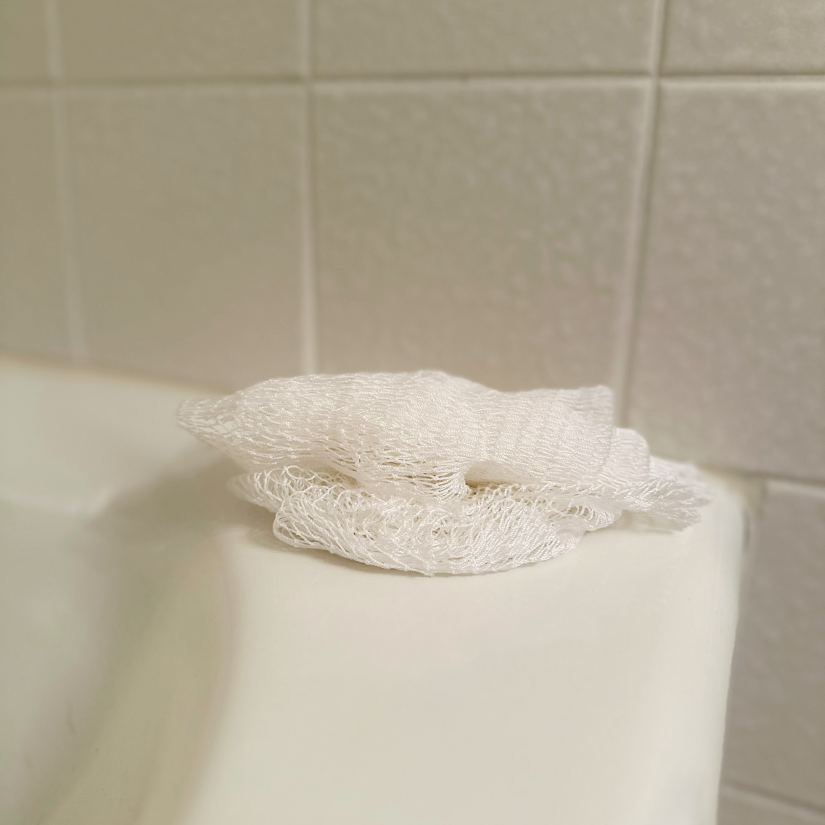 African Net Sponge - White, on tub