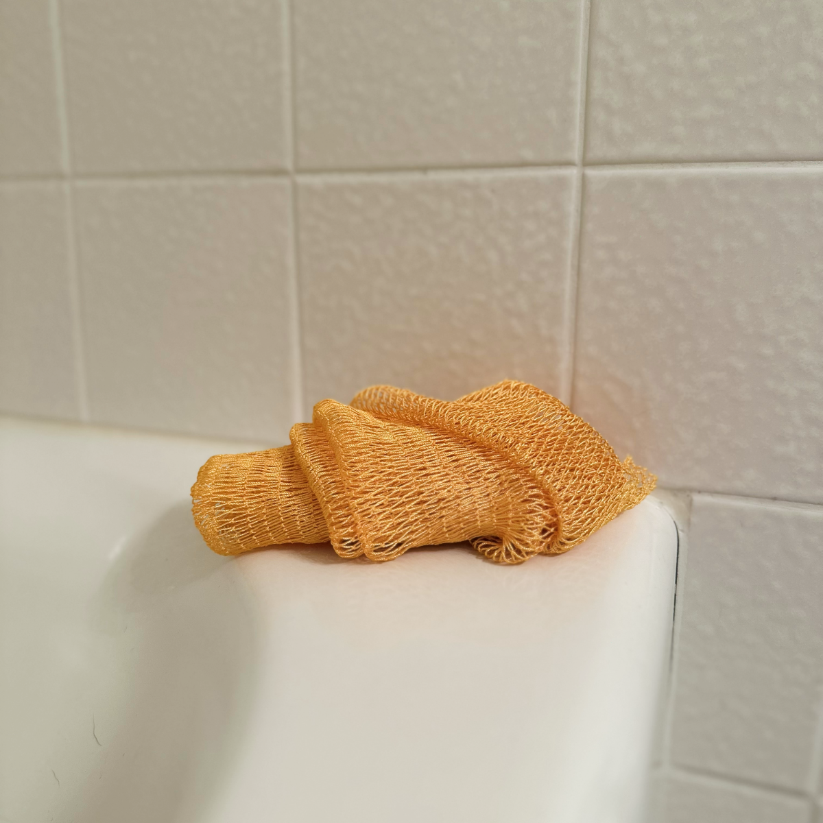 African Net Sponge - Yellow, on tub