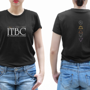 A person stands facing the camera showing the front of a black t-shirt adorned with the full ITBC™ logo that included elemental symbols+ Magic In Action+ ITBC +I'm The Beautiful Change. The person also stands facing away from the camera showing off the back image of the shirt: five elemental symbols for Spirit, Air, Fire, Earth, and Water in a vertical line
